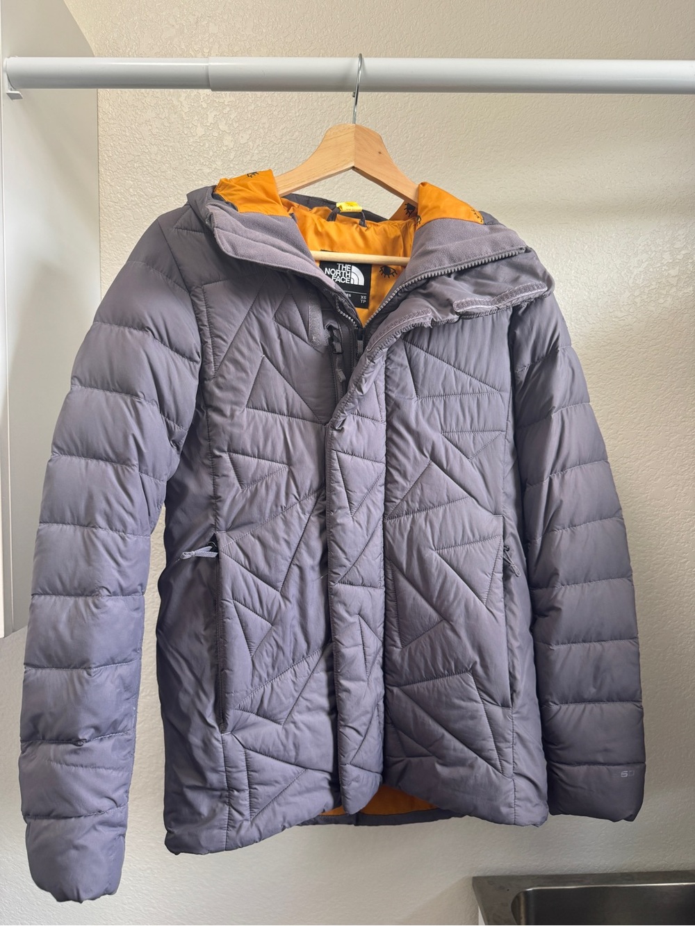 The North Face Charcoal Puffer Jacket with Orange Hood Lining